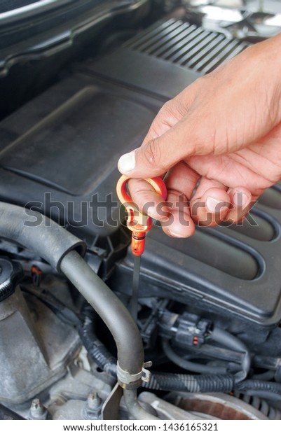 Engine system Maintenance Engine check Car\
care equipment.Check level. Car engine\
oil.