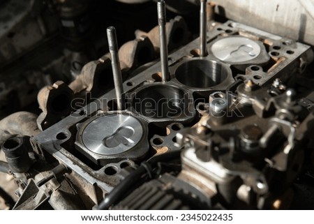 engine under repair, repairing an engine, assembling an engine with new pistons