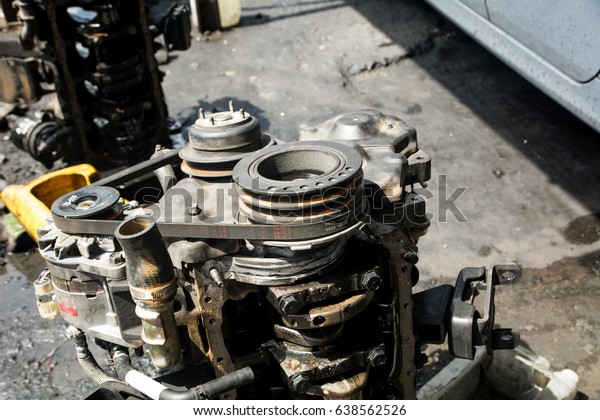 Engine\
valve car maintenance.The cylinder block of the four-cylinder\
engine. Disassembled motor vehicle for repair.\
