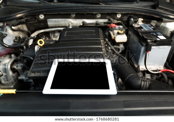 The\
engine a vehicle car hood for safety inspection\
test