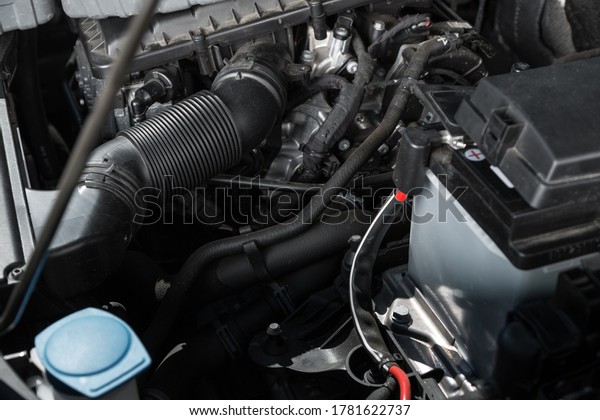 The\
engine a vehicle car hood for safety inspection\
test
