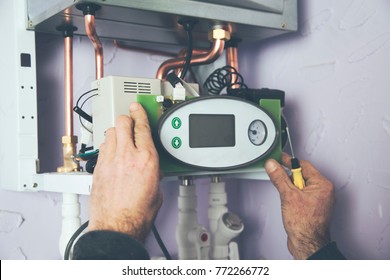 Engineer Adjusting Thermostat For Efficient Automated Heating System