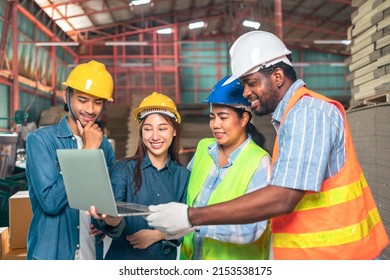 Engineer African Man And Asian Worker Wearing Safety Helmet And Vest Holding Notebook And Take Note On The Paper  Warehouse.Products And Corrugated Cardboard. Factory For The Manufacture.