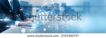 Engineer analyzing cloud computing infrastructure using laptop, virtual server management, scalability, and data storage analytics.