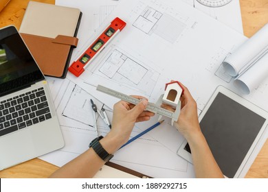 Engineer And Architect Concept, Engineer Architects  And Interior Designer Working With Blueprints