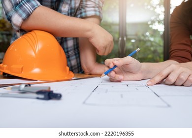 Engineer and Architect concept, Engineer Architects and Interior designer working with blueprints.