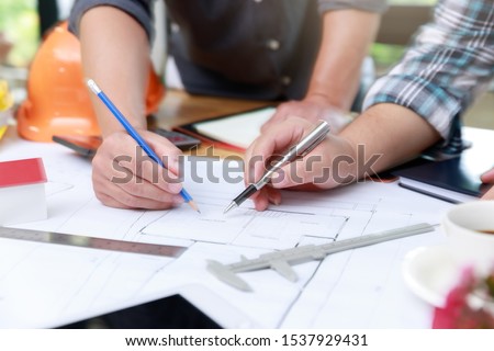 Engineer and Architect concept, Engineer Architects  and Interior designer office team working with blueprints