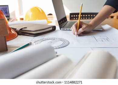 Engineer and Architect concept, Engineer Architects and real estate agent office team working with blueprints