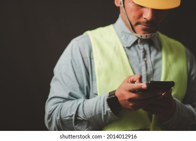 Engineer, architect or designer in hand and using smartphone to communicate with design architect for construction management.
