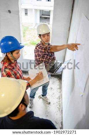 Engineer and architects working and discussing at construction site. Owner inspection at village project and estate building.