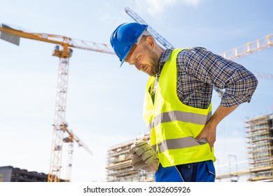 Engineer With Back Pain Injury After Accident At Construction Site - Shutterstock ID 2032605926
