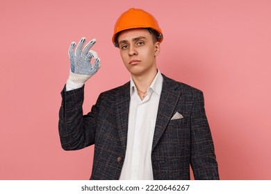 An Engineer In A Business Suit With A Sad Expression Shows A Sign Ok Or Everything Will Be Fine