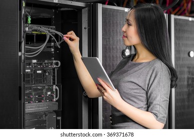 Engineer Businesswoman In Network Server Room