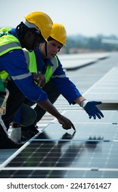 Engineer in charge of solar panel installation The installation of solar energy conversion into electricity for a warehouse is currently being investigated.