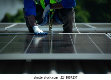 Engineer in charge of solar panel installation The installation of solar energy conversion into electricity for a warehouse is currently being investigated.