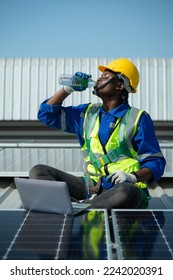 Engineer in charge of solar panel installation The installation of solar energy conversion into electricity for a warehouse is currently being investigated.