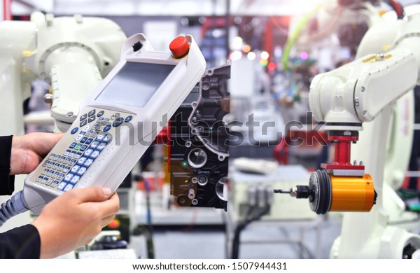 Engineer check and\
control automation Modern robotic machine vision system in factory,\
Industry Robot concept\
.