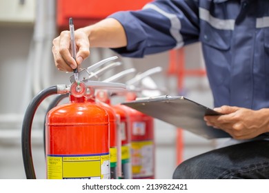 Engineer Are Checking And Inspection A Fire Extinguishers Tank In The Fire Control Room For Safety Training And Fire Prevention.