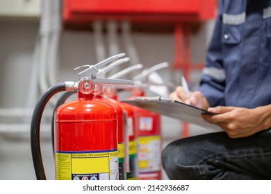 Engineer Are Checking And Inspection A Fire Extinguishers Tank In The Fire Control Room For Safety Training And Fire Prevention.