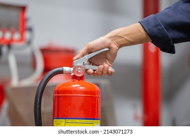 Engineer Are Checking And Inspection A Fire Extinguishers Tank In The Fire Control Room For Safety Training And Fire Prevention.