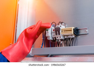 The engineer checks the absence of induced voltage on the high voltage cells