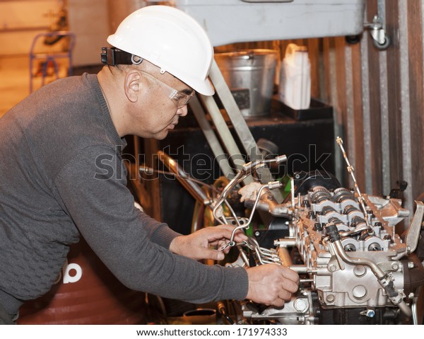 Engineer Checks Automobile Mechanism Garage Stock Photo Edit Now