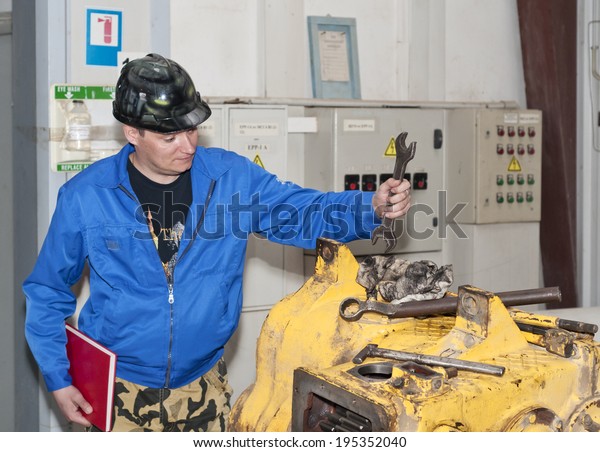 Engineer Checks Automobile Mechanism Garage Stock Image Download Now