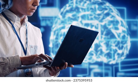 Engineer in cloud computing business uses artificial intelligence computing simulating human brain thought processes. Admin performing operations on laptop with AI machine learning algorithms