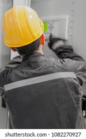 Engineer commissioning bay control unit. Engineering department. Medium voltage switchgear