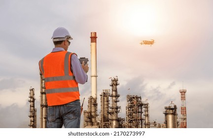 Engineer Construction Used Drone Take Photo Aerial View For Inspection And Survey At Oil Refinery Factory Background.