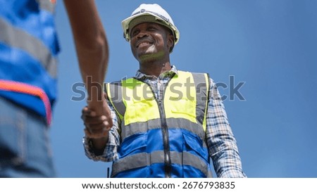 Engineer and Construction Worker Greeting with Handshake at Building Site, Collaboration and Agreement Between Foreman and Engineer at Worksite