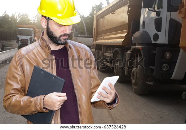 Engineer Construction Worker Operating Touch Pad Stock