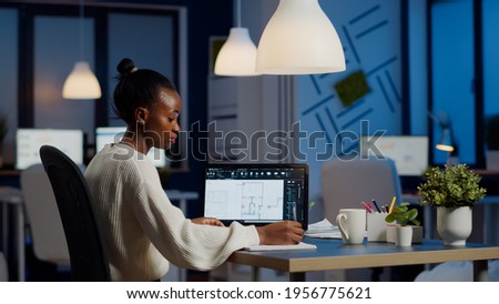 Engineer constructor designer architect creating new bluilding plan in CAD program working in business office. Industrial woman employee studying prototype idea showing cad software on device display