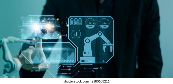 Engineer control automated robot arm machine in factory,smart visual interface screen artificial intelligence or AI,machine learning operation,concept business and industry 4.0,5G network technology - Shutterstock ID 2180108211