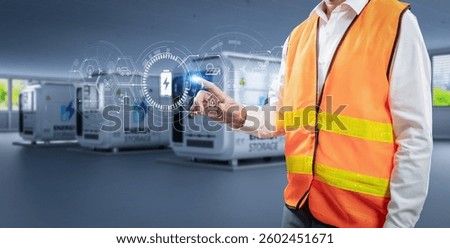 Engineer control energy storage system or battery container unit in factory with digital graphic display