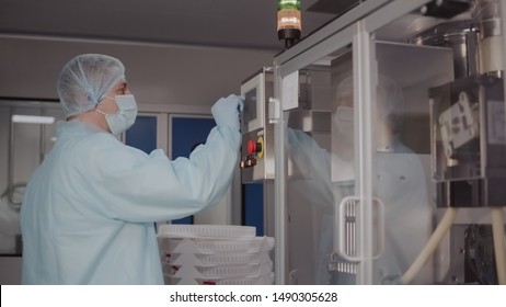 Engineer control pharmaceutical manufacturing. Factory worker operating pharmaceutical equipment. Pharmacy industry. Factory worker programming control manufacturing line. - Powered by Shutterstock