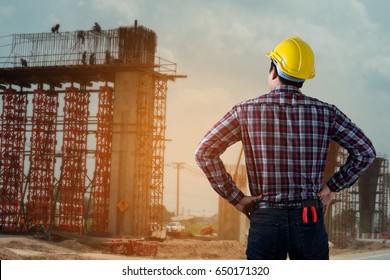 Engineer Control Working At Under Construction.Work Safety Officer Or Civil Engineer. Team Worker On Background