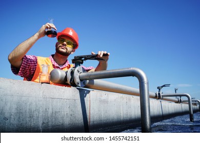                       An engineer controlling a quality of water ,aerated activated sludge tank at a waste water treatment plant.  pollution         