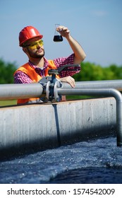                      An engineer controlling a quality of water ,aerated activated sludge tank at a waste water treatment plant.  pollution   