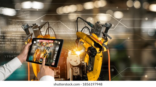 Engineer Controls Robotic Arms By Augmented Reality Industry Technology Application Software. Smart Robot Machine In Future Factory Working In Concept Of Industry 4.0 Or 4th Industrial Revolution.