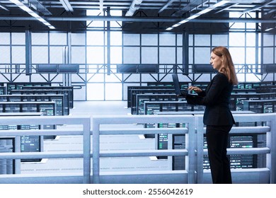 Engineer in data center checking rigs and infrastructure, doing maintenance. IT expert planning and executing high tech server hub facility migrations and upgrades using laptop