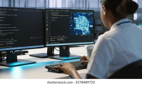 Engineer in data center implementing advanced AI driven predictive maintenance systems to proactively identify and resolve potential hardware failures before they impact operations, camera A