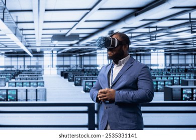 Engineer in data center implementing backup solutions to protect against data loss using VR headset, ensuring efficiency. Server room worker resolving technical issues using virtual reality tech - Powered by Shutterstock