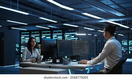 Engineer in data center installing software on computer, troubleshooting issues, handheld camera shot. IT professional in server hub establishing performance benchmarks, camera B