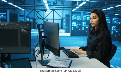 IT engineer in data center using PC to find misconfigurations affecting rackmounts performance. Woman checking servers bottlenecks leading to sluggish data transfer rates and malfunctions