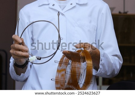 The engineer demonstrates capillary and nozzle columns for gas chromatographic analysis. laboratory equipment for analytical chemistry