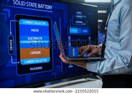 Engineer design solid state battery pack for electric vehicle (EV) on electronic screen, Battery technology that uses solid electrodes and a solid electrolyte.