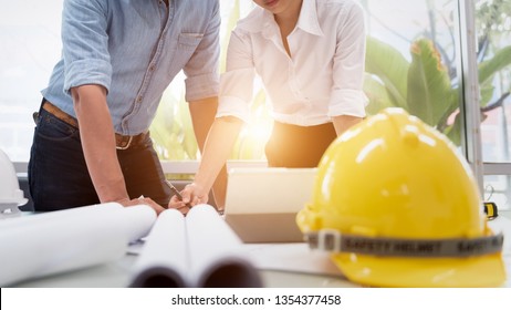 Engineer Designer People Drawing and Planning with Blueprint Architecture on Desk office. Drafting and Design Worksheets Before Startup Project Concept.