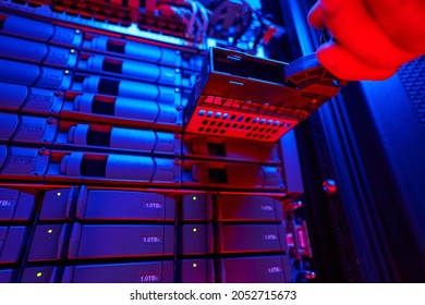 It engineer is disassembling and repairing computer server in data center