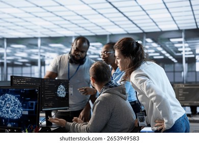Engineer doing brainstorming with colleagues to fix error in code affecting server room AI workloads. Team of artificial intelligence experts repairing data center systems together